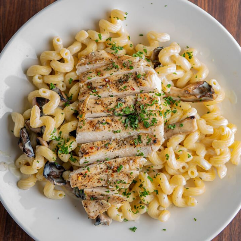 stranghall's tweet photo. Chad of @norcinikc is working hard to get orders ready &amp; out the door. His Italian Herb Grilled Chicken is a delectable new menu item; try it for yourself by ordering here: https://t.co/YYmDjZcC6v.  #StrangHall https://t.co/HIKLwDiH4T