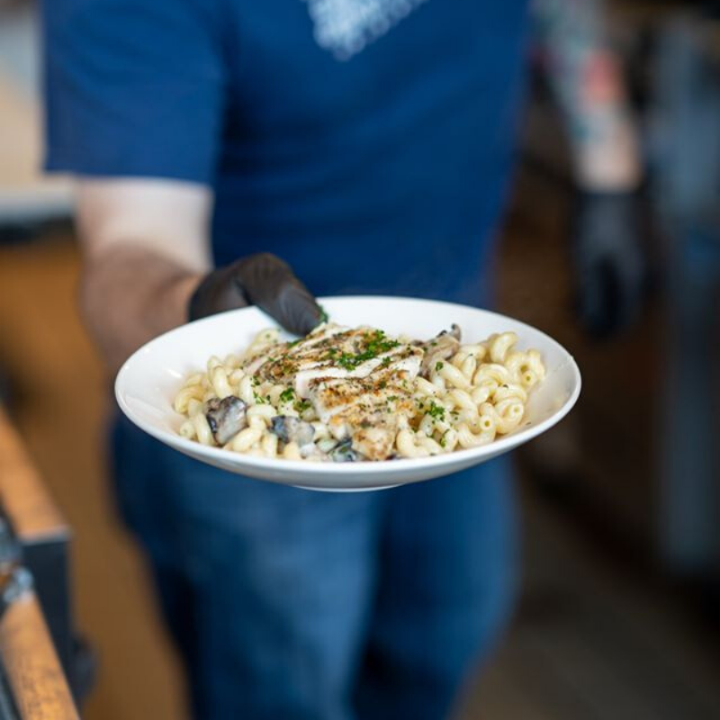 stranghall's tweet photo. Chad of @norcinikc is working hard to get orders ready &amp; out the door. His Italian Herb Grilled Chicken is a delectable new menu item; try it for yourself by ordering here: https://t.co/YYmDjZcC6v.  #StrangHall https://t.co/HIKLwDiH4T