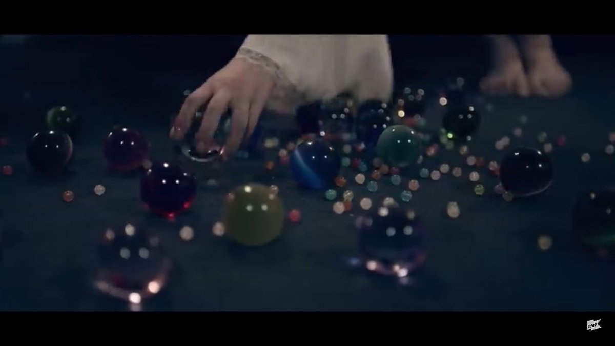 But what do these glass beads do? What are they? Well, I believe that they are like tracking devices, as Eunha can watch each girl individually. We see that Eunha and SinB are the only ones that have glass beads, where Eunha has it to spy on SinB and SinB has tiny ones after-