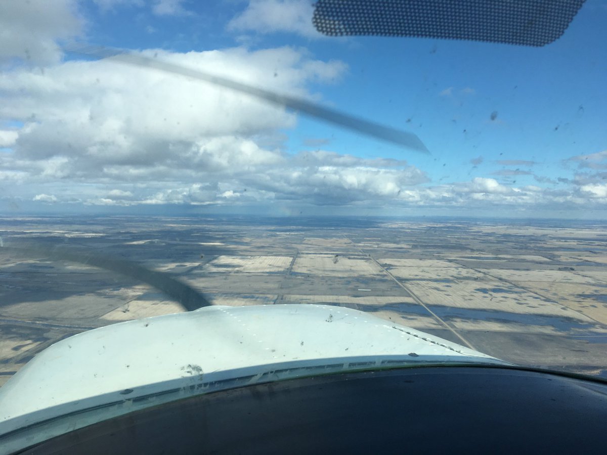 GSarty's tweet image. Over Marcelin - if you look close into the rain you can see a rainbow.