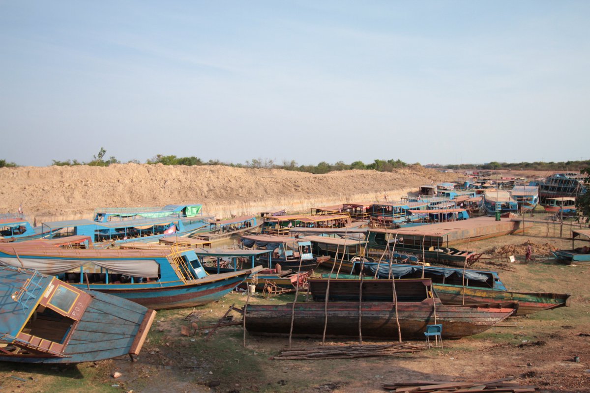 f3rno's tweet photo. Near Siem Reap, tour boat parking waiting for water levels to rise, and tourists to return. #siemreap #cambodia https://t.co/HUsKF05C9d