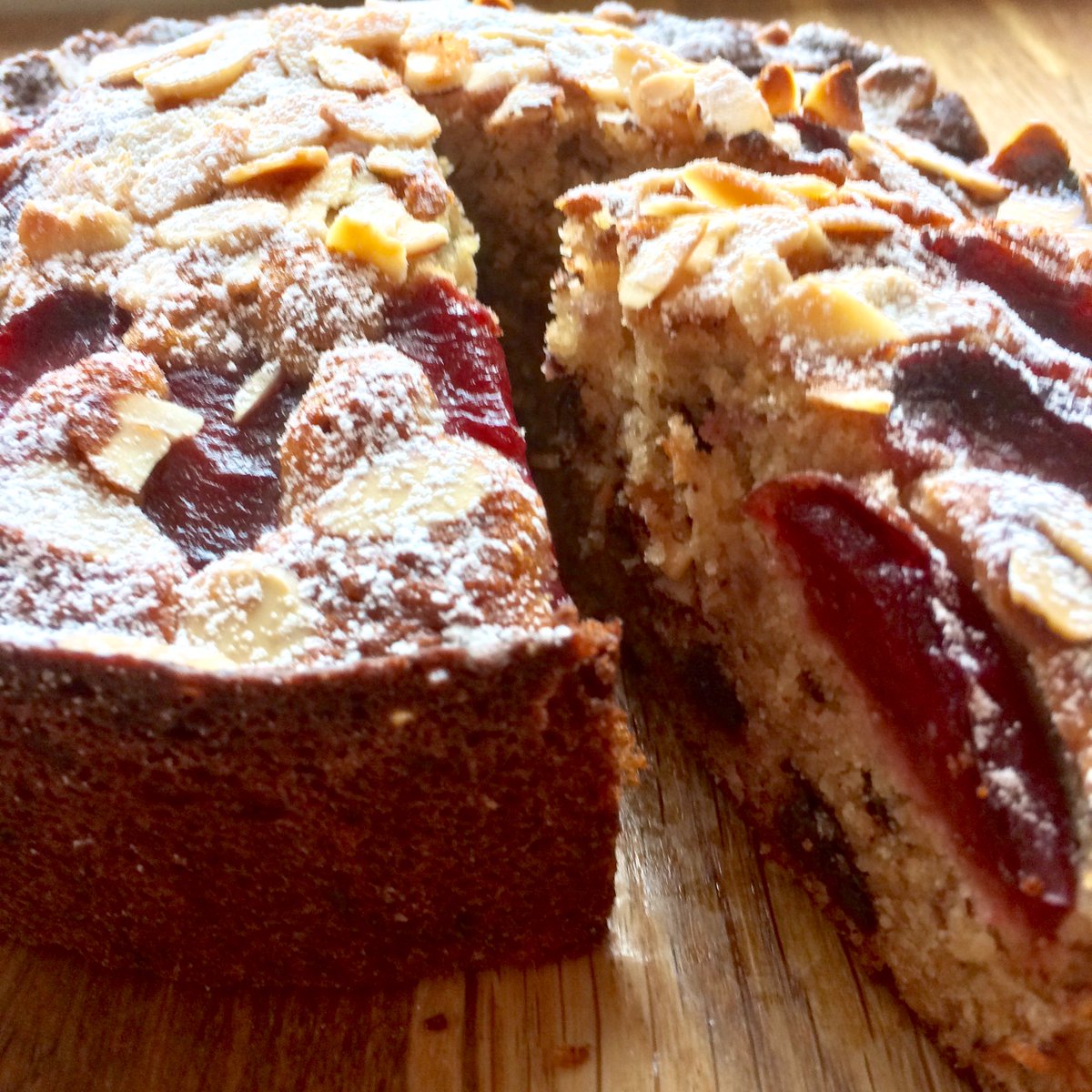 blisswoo's tweet image. Plum, almond and chocolate cake, using plums from the freezer. The recipe, from @bbcgoodfood, is meant to use hazelnuts but I didn’t have any, so almonds it is. It’s really nice but crying out for a big dollop of cream! #twitterbakealong #isolationbaking