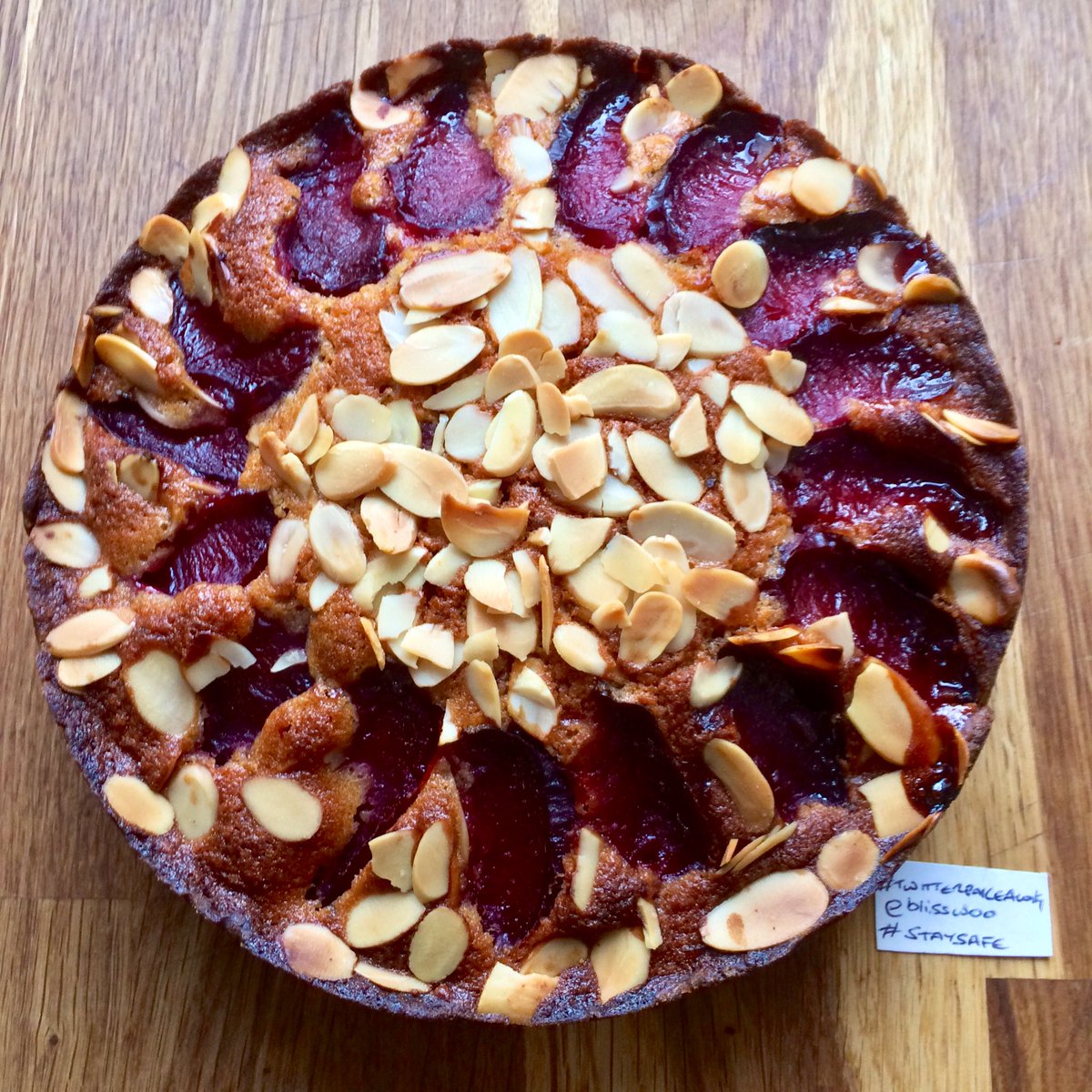 blisswoo's tweet image. Plum, almond and chocolate cake, using plums from the freezer. The recipe, from @bbcgoodfood, is meant to use hazelnuts but I didn’t have any, so almonds it is. It’s really nice but crying out for a big dollop of cream! #twitterbakealong #isolationbaking