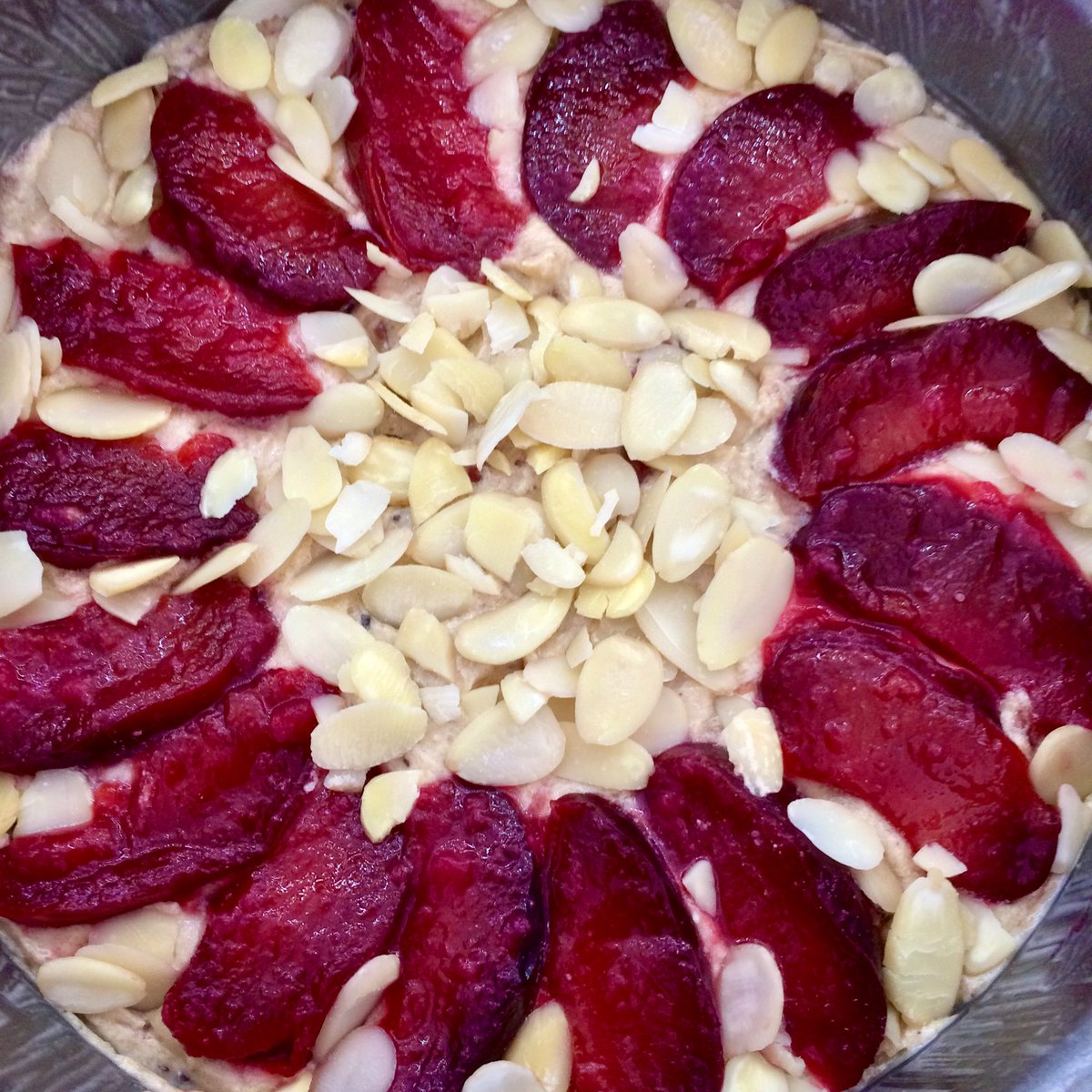 blisswoo's tweet image. Plum, almond and chocolate cake, using plums from the freezer. The recipe, from @bbcgoodfood, is meant to use hazelnuts but I didn’t have any, so almonds it is. It’s really nice but crying out for a big dollop of cream! #twitterbakealong #isolationbaking