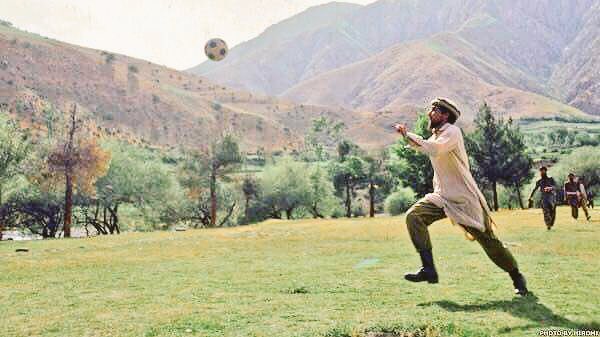 Massoud playing football.