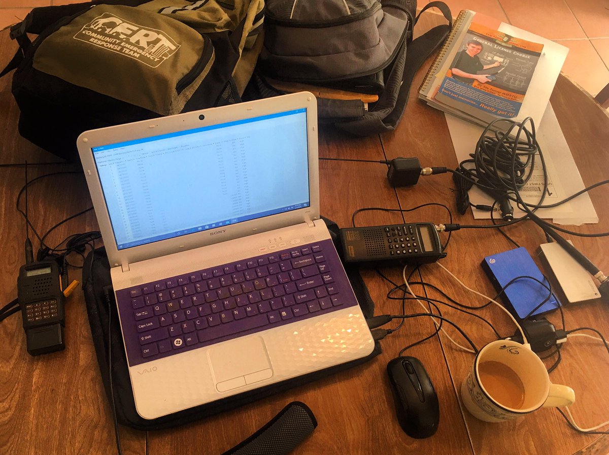 TruckerHam's tweet photo. #TruckerHam’s dining room table during a 34hr reset. Reprogramming radios and scanners with Florida frequencies. #KE0FFT https://t.co/6XQbsjbAkj