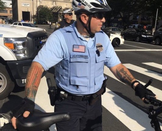 Tying some things together, here are some police with troubling tattoos:A Gasden Flag snake over a US flag, “We The People” paired with the III%er symbol, and most troubling of all, “Fatherland” https://en.wikipedia.org/wiki/Three_Percenters