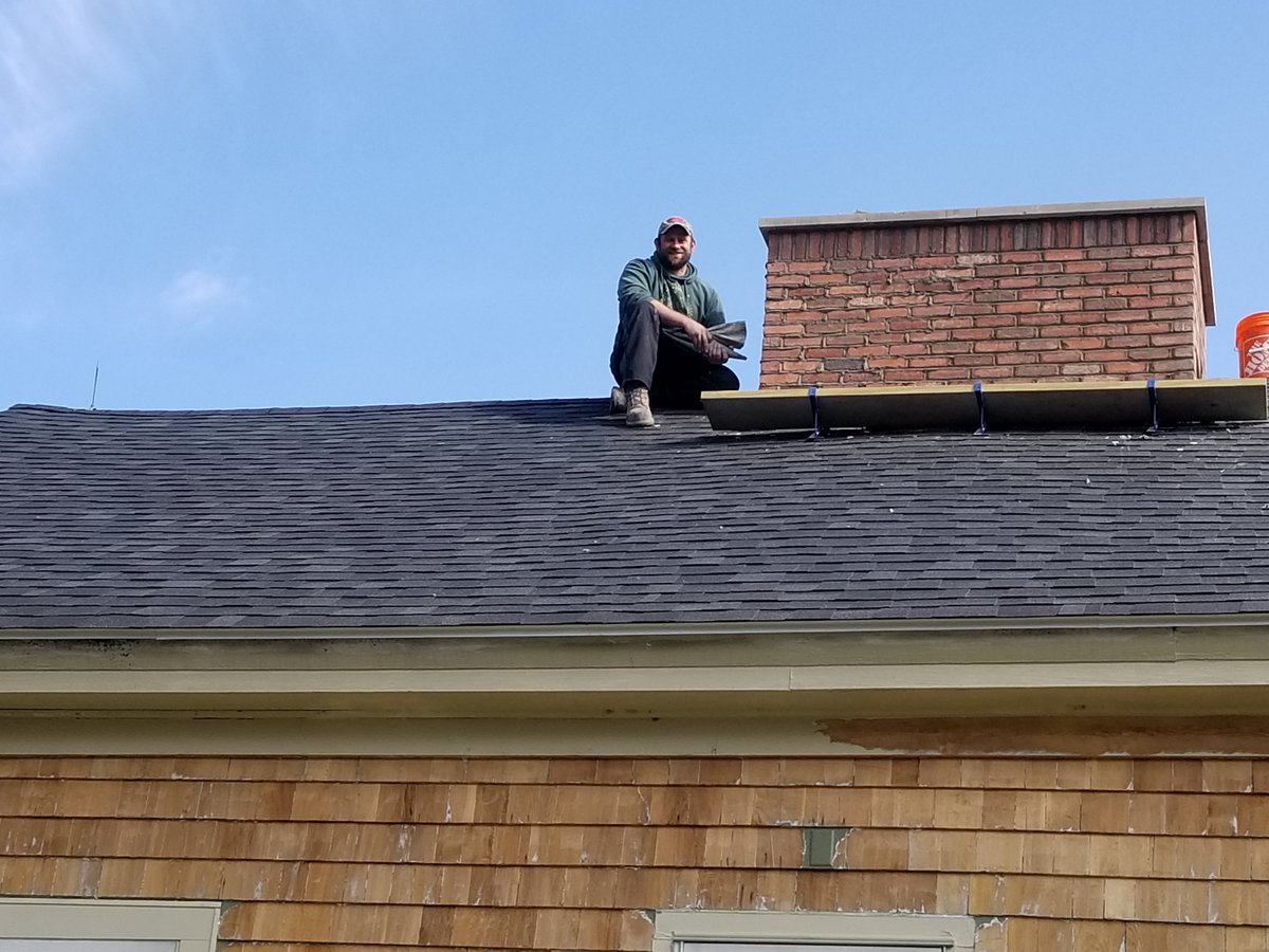 andrewbostom's tweet photo. #OpenUpAmericaNow #OpenUpRI Out walking my huskies this morning in NW Rhode Island, I took a photo of a mason who had nearly completed the used brick with dark mortar veneer of a chimney. Trades people never stopped working out here despite the "lockdown" https://t.co/4duIL2V6b5