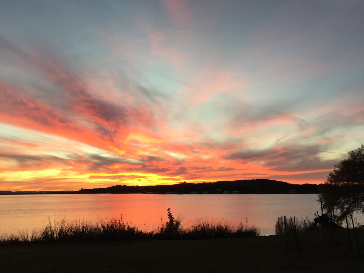 Funwithlucy's tweet image. I would definitely rather be camping - laying in a hammock with a good book and a can of pringles. @InksLakeSP #missingcamping #CountdownEntry #Beautifulsunset