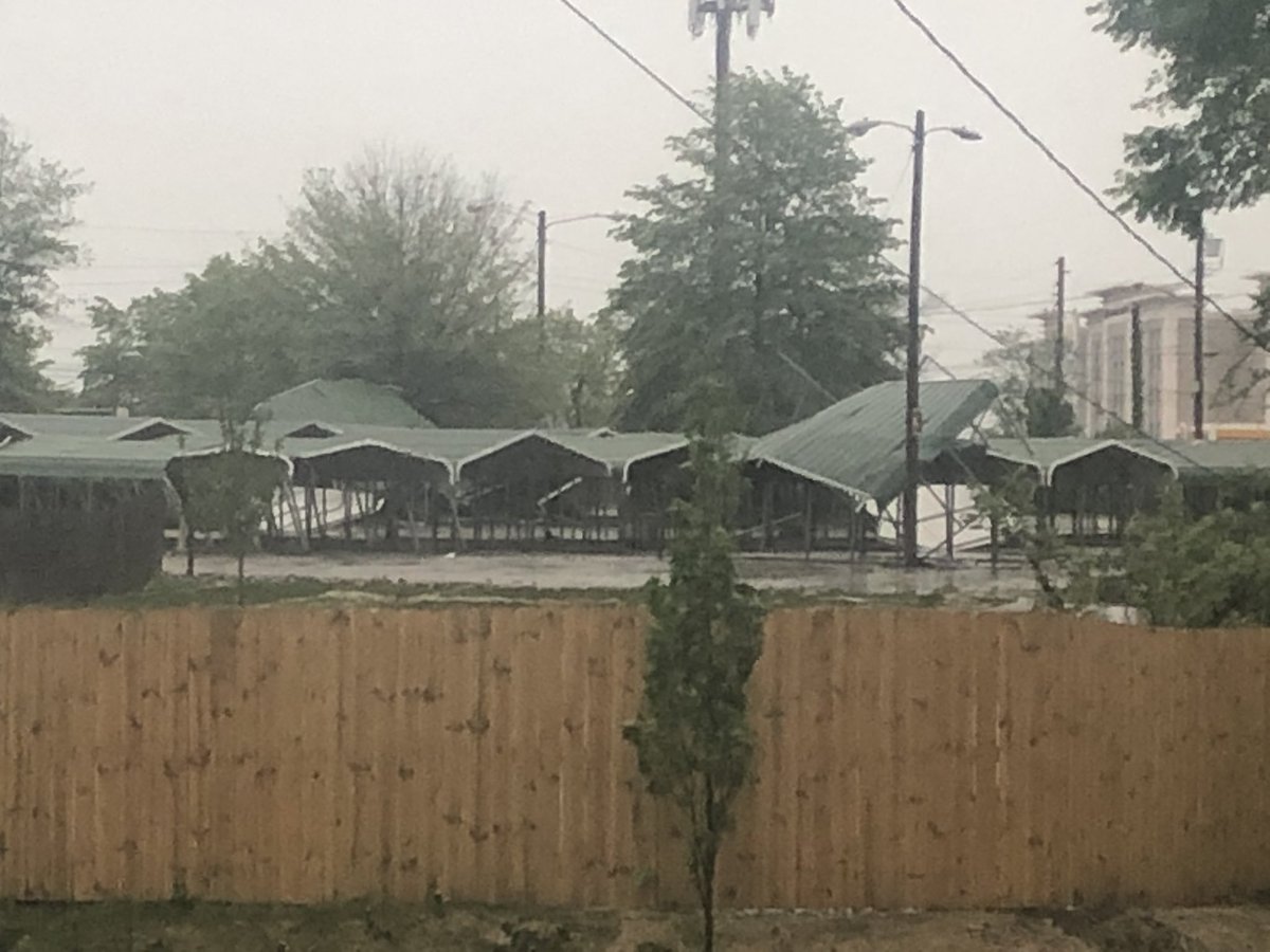 lomaesocks's tweet photo. @NashSevereWx the carports from the parking spot across from our house all flew into the air on top of one another and lots of trees down https://t.co/omzW8EAomn