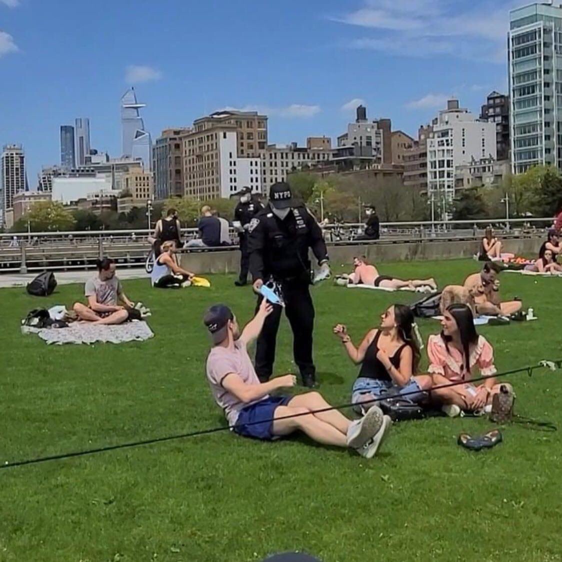 Same city. Same police force. 

Passing out masks to white folks not social distancing, while literally having their foots on our necks. 

This is beyond ridiculous at this point.