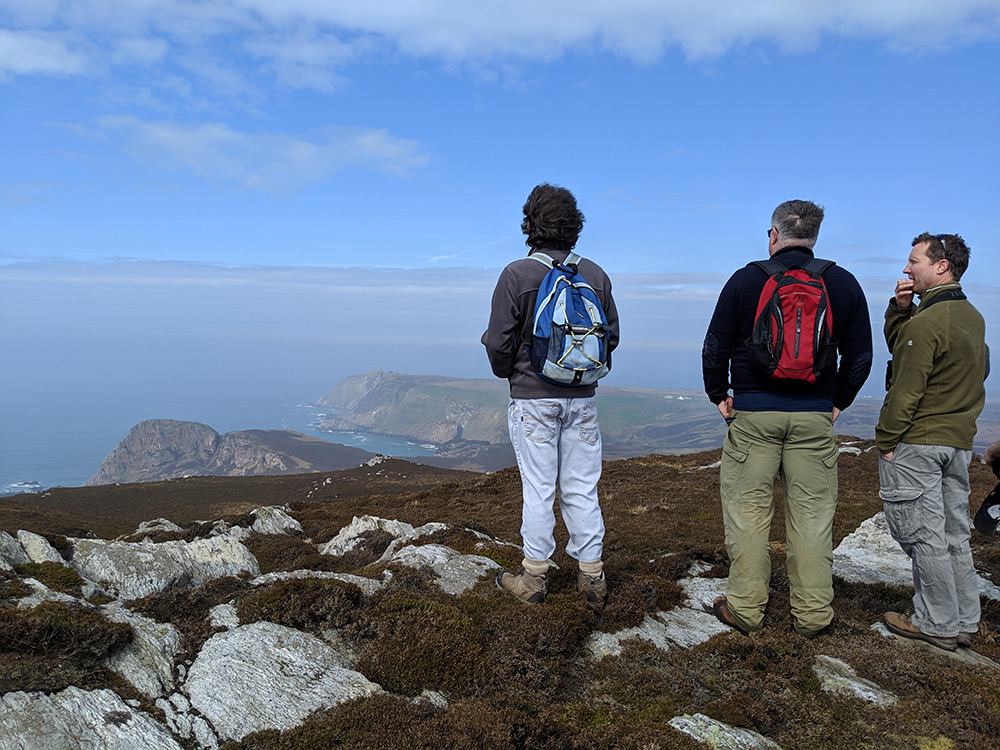 islayblog's tweet photo. Good morning with a #WalkIslay memory of 2019 of some walkers pondering a hazy view from Beinn Mhòr, Isle of Islay https://t.co/CRxIsnKbYy https://t.co/kAty432jPz