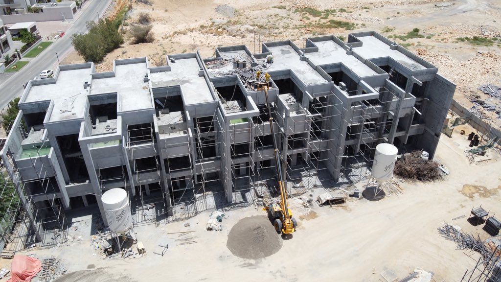 MalikDevs's tweet photo. Aerial shots of Rose Village which is now more than 50% complete and sold out! Selective units have also been plastered as shown in the first shot. Visit the Muscat Hills sales office to learn more about one of Muscat’s most prestigious  upcoming freehold neighborhoods. https://t.co/Y6Nz3hOuo3