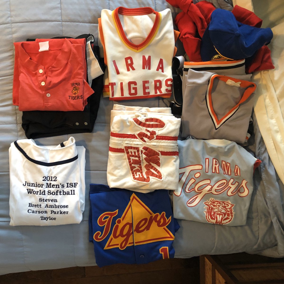 wfirkus's tweet image. It’s the closet organizing stage of Covod-19 in our house.  Mervin has a great time reminiscing over his Tiger glory years.  (And a leftover Vegas shirt) #irmatigers