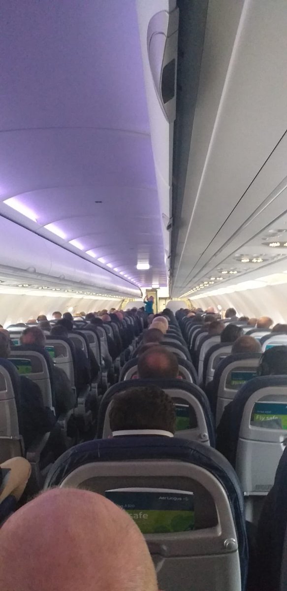 KellyBonner's tweet photo. This was the @AerLingus flight from @BELFASTCITY_AIR to @londonheathrow this morning at 8:45. No social distancing taking place - one passenger told me they weren’t given any advice on how to keep themselves safe. More on @BBCevex next @taramillstv @NewsDeclan https://t.co/eeAfcGf23O