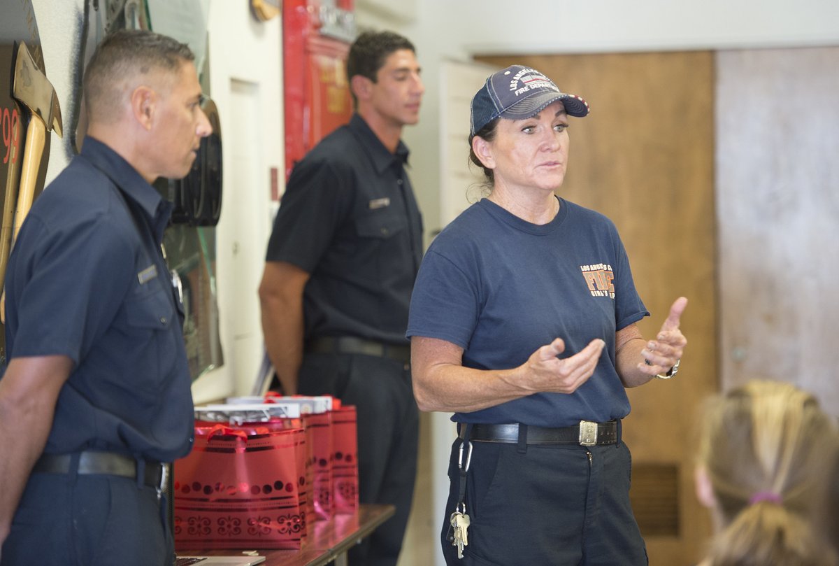 a female firefighter running a training