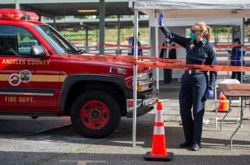 a female firefighter at a COVID-19 testing site