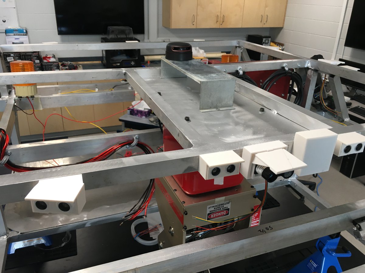 KevinHubick's tweet photo. Just need to run some sensor cables and Eric can transfer his prototype work from the bench top to the rover. Really looking forward to having a lab full of students again 😃. The 360° rotational RP-LIDAR is temporarily placed on top for testing purposes. #SturgeonRobotics https://t.co/MX9DRTFT2g