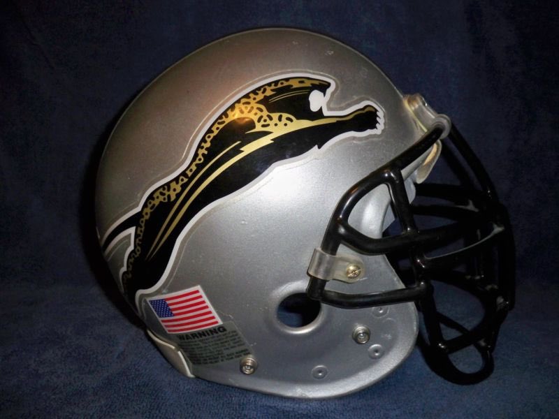 Helmet Stalker on X: 'The team's original helmet was to be silver with a  'leaping jaguar' logo, a number of stripes and a black facemask. The team  received pushback by Jaguar Cars,