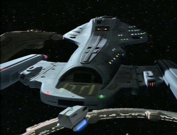 TrekCore's tweet photo. The shuttle that ferries Tom Paris to Voyager at DS9  ("Caretaker") starts off with the Enterprise-D's registry number (1701-D) but is corrected to Voyager's (74656) in the next shot -- making it a rare moment to have elements from the three 90's series in one sequence. #StarTrek https://t.co/f3SPnupfwz