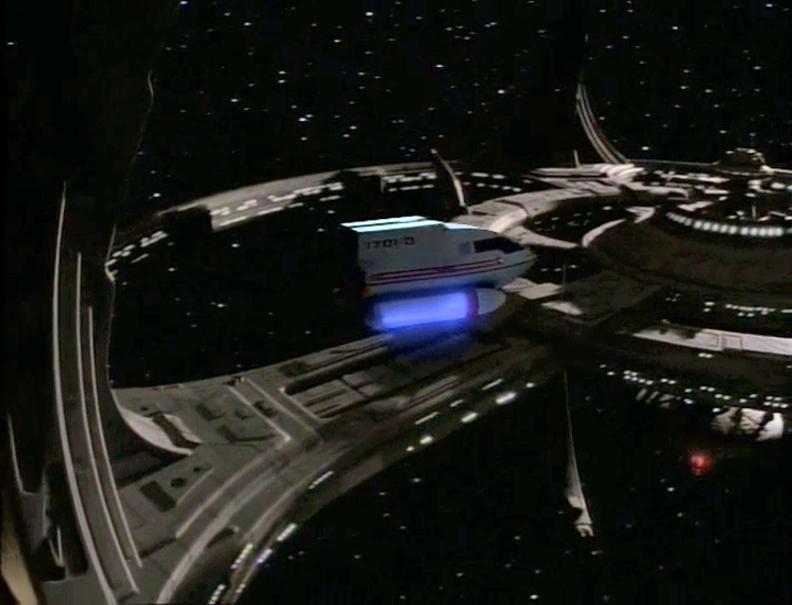 TrekCore's tweet photo. The shuttle that ferries Tom Paris to Voyager at DS9  ("Caretaker") starts off with the Enterprise-D's registry number (1701-D) but is corrected to Voyager's (74656) in the next shot -- making it a rare moment to have elements from the three 90's series in one sequence. #StarTrek https://t.co/f3SPnupfwz