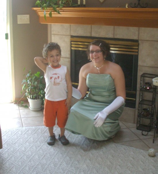 MeyerNPHS's tweet photo. Prom 2009, posing with my sweet nephew Marley. I can't believe he's a FRESHMAN now. (At Greenfield, not with us, sadly!) #NPHSVirtualProm https://t.co/GYvi7VCb9H