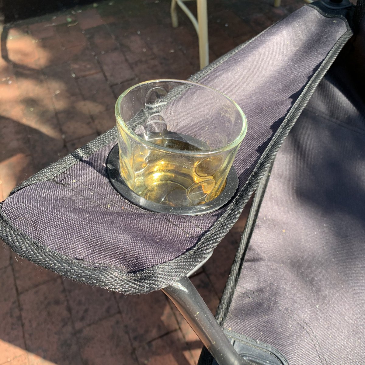 Whisky in a folding chair cup holder