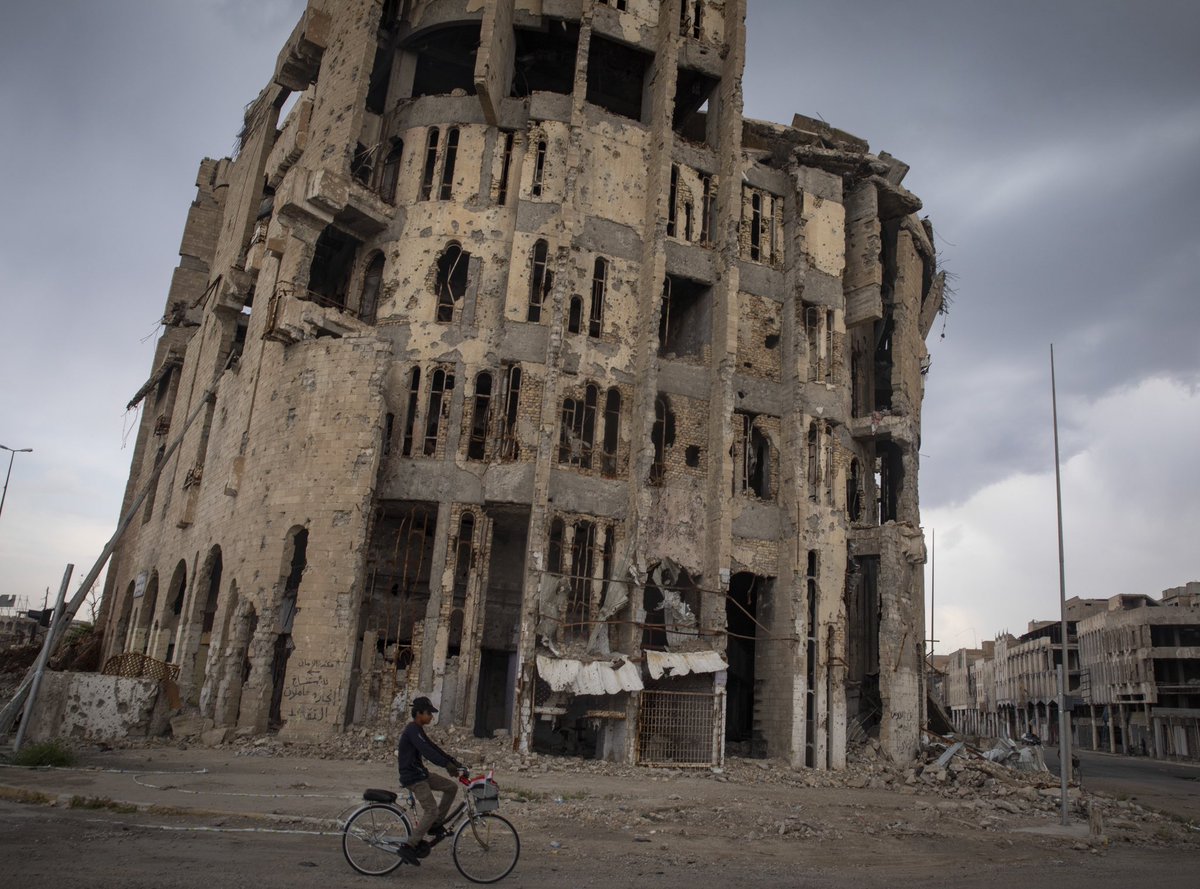 Afshin_Ismaeli's tweet photo. A boy rides his bike past destroyed houses in old city of #Mosul. #iraq #isis #postisis https://t.co/QZJlLX1k6n