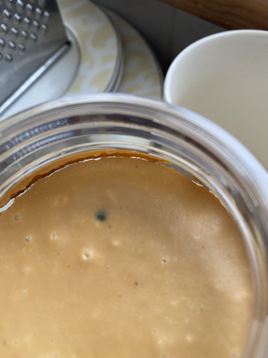 AdamBBrowne's tweet photo. @SunPatOfficial What’s going on here please? Is that dark patch bacteria/mold or is it safe to eat? And why does the peanut butter look ‘dried out’? Thanks https://t.co/WROW0ArXxS