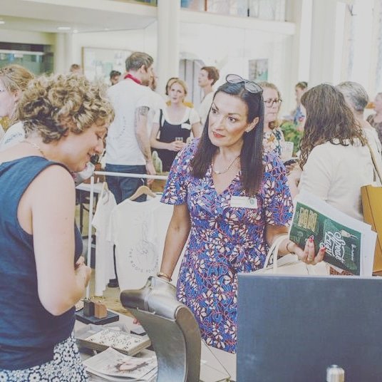tweetinexeter's tweet photo. Remembering sunnier times - the rather lovely Summer of Independents event last year – so many people in one room! Crafters, makers, bakers and even barbers gathered with their one-of-a-kind products and services at St Stephens Church #shoplocal #exeterINDY 🌈 https://t.co/Hs36trL09U