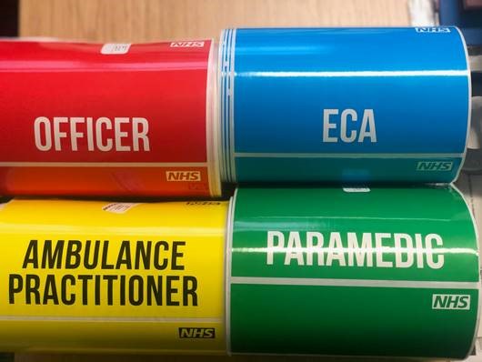 MindvisionUK's tweet photo. In full NHS protective gear, how do you know who's who? @swasFT @NHSuk contacted us about this. We  supported them and supplied colour coded ID stickers that had space for a name &amp; title. A huge thank you to all the front line workers - this is the least we can do to support you! https://t.co/arE2FO7jyn