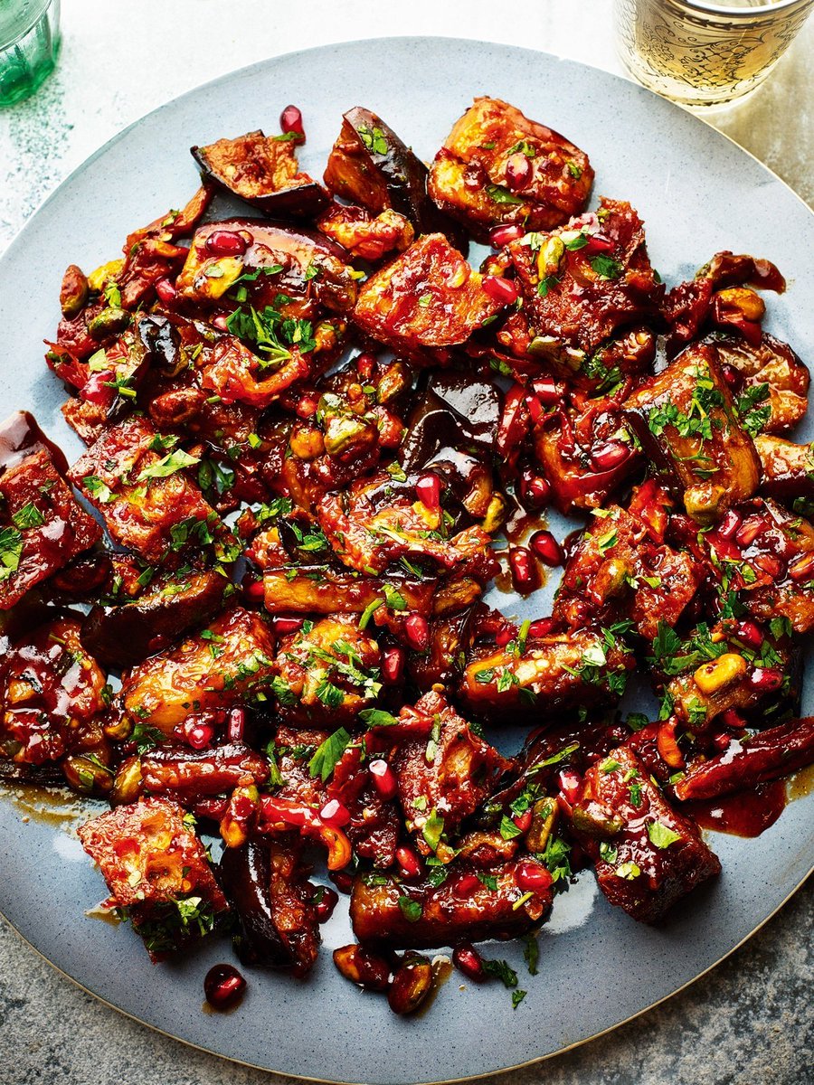 If we could magic up any meal right now it would be @sabrinaghayour's pomegranate and aubergine salad with harissa and sun-dried tomatoes. You can find the full recipe in FEAST - the cookbook for a delicious array of Middle-Eastern dishes ✨