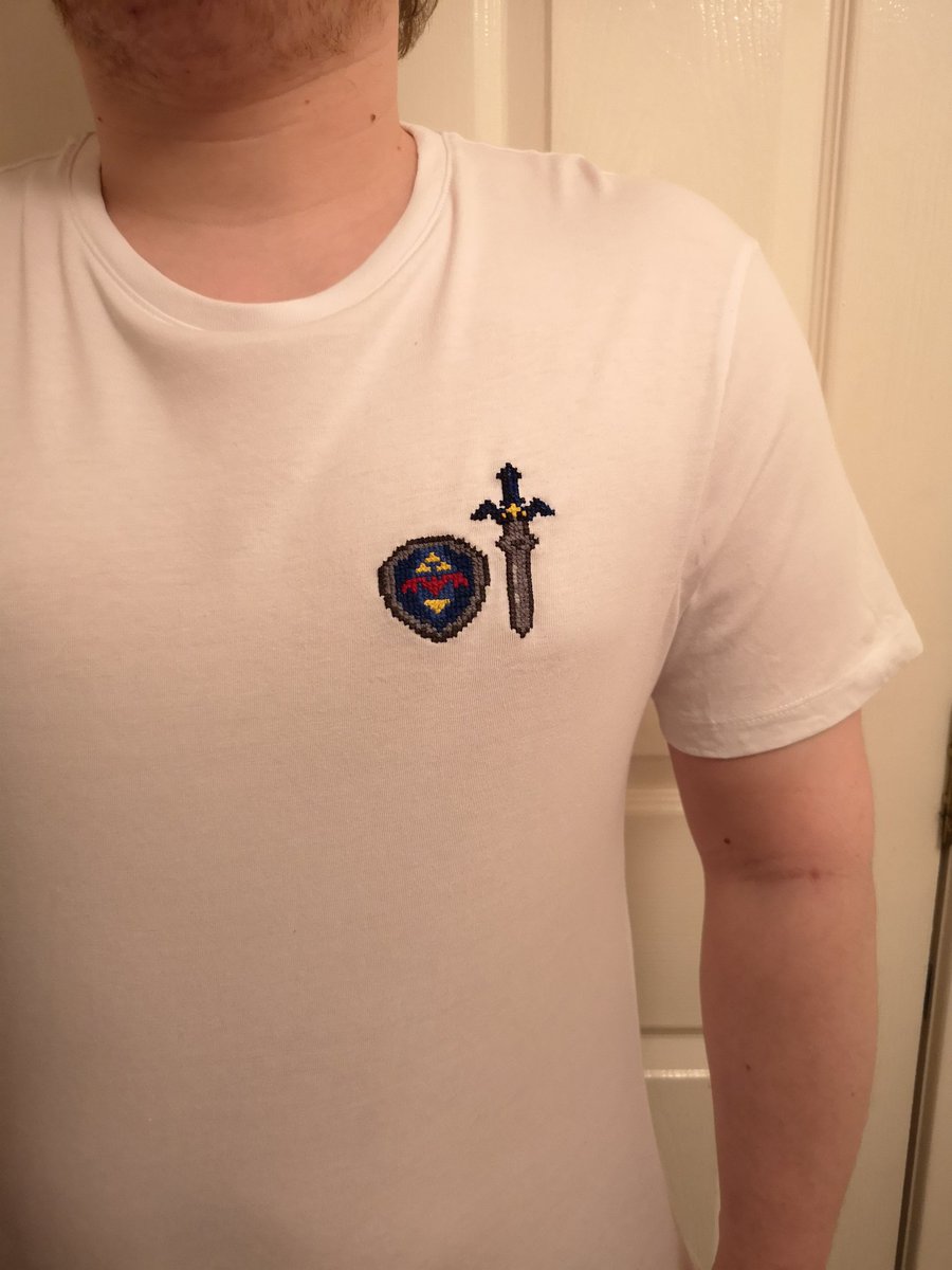 Will I ever remember this thread on time? T-shirt with master sword and hylian shield cross stitched into it!