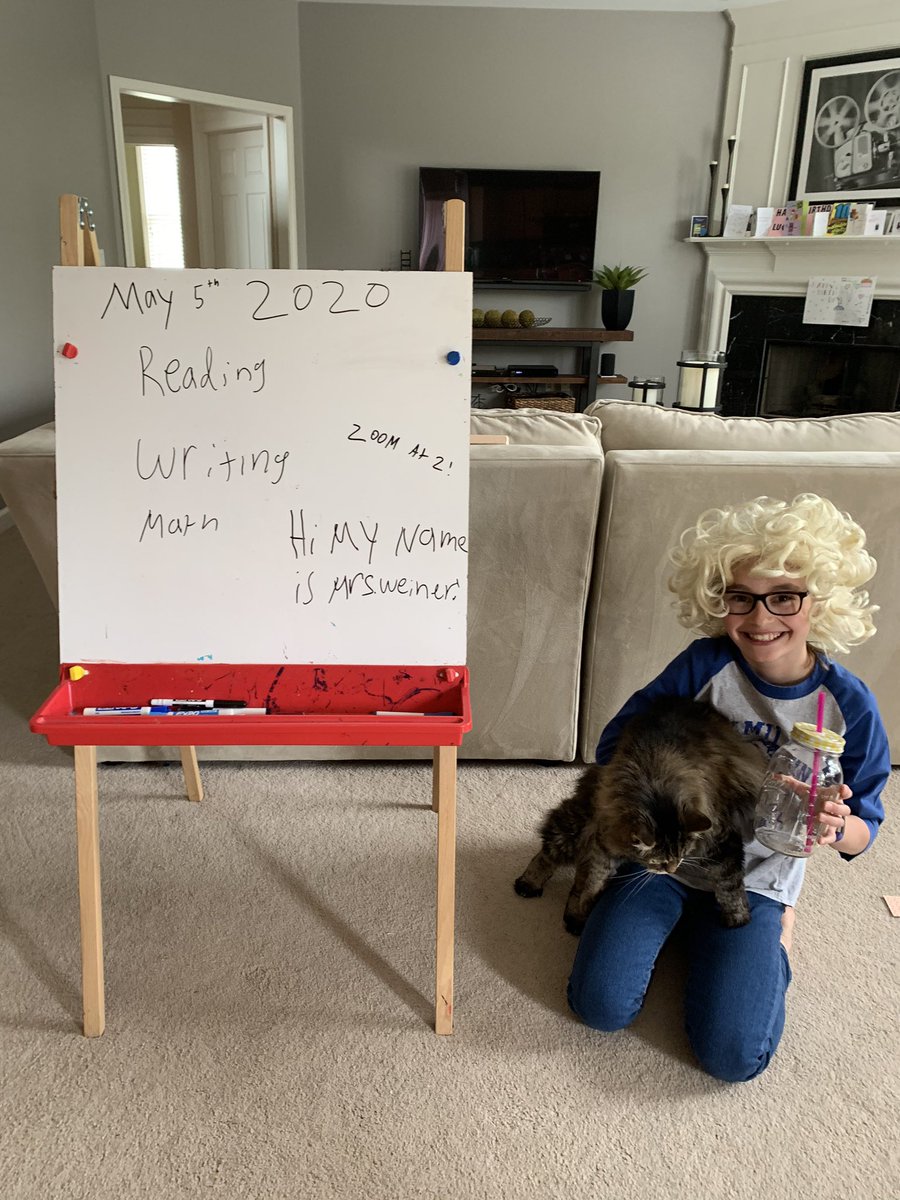 cnendres's tweet photo. “Mrs. Weiner” must have woken up late today - look at that hair!  But at least she has her cat Angel to help her with her lessons! 👩🏼‍🏫 We love you @Rweiner333 ! @HamiltonHawks82 #hawkhomeadventure https://t.co/MrDxZUP5Ui
