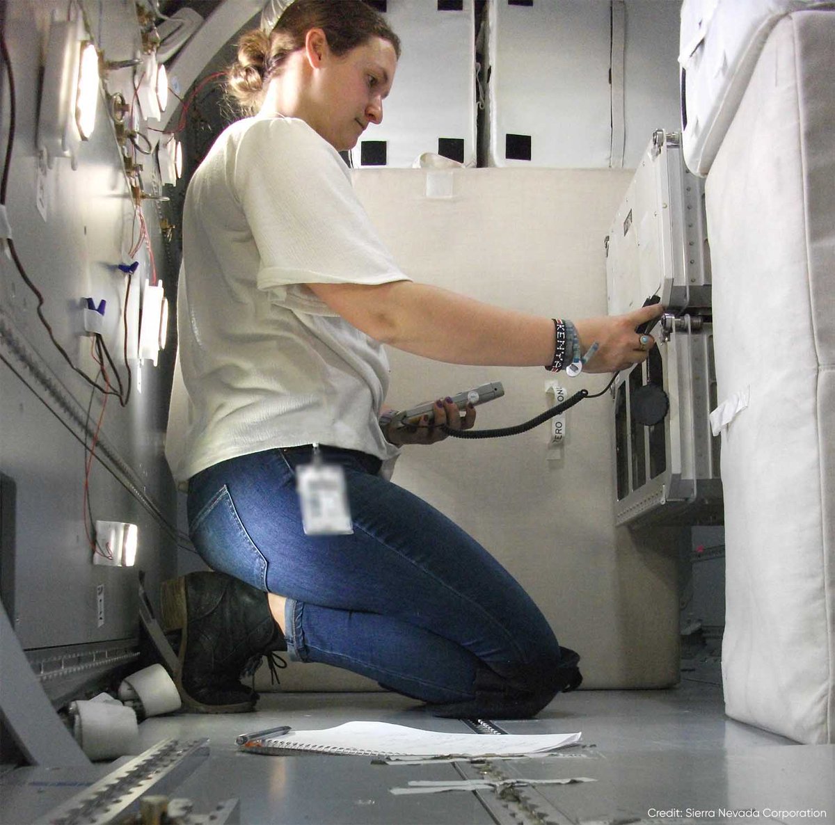 SierraNevCorp's tweet photo. Carson here! I’m taking measurements of the illumination produced by the internal lights using a light meter to facilitate communication between SNC &amp; @NASA. This area is considered a workstation &amp; must be lit well enough so a crew member can read, write &amp; perform science. https://t.co/6URqQCcjC6