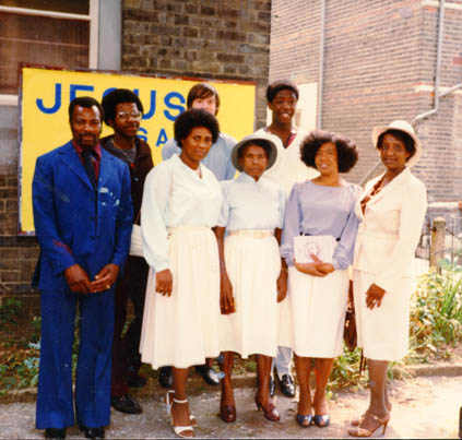weareherewf's tweet photo. Many #WalthamForest #Windrush residents have dedicated themselves to church life.  The lady pictured here (lilac shirt)  has been a member of  Cann Hall Rd Baptist Church for 40+ years. Source: Watson Archive @heritagefunduk @wfcouncil #history #blackhistory #church #religion https://t.co/2FWrgielP9