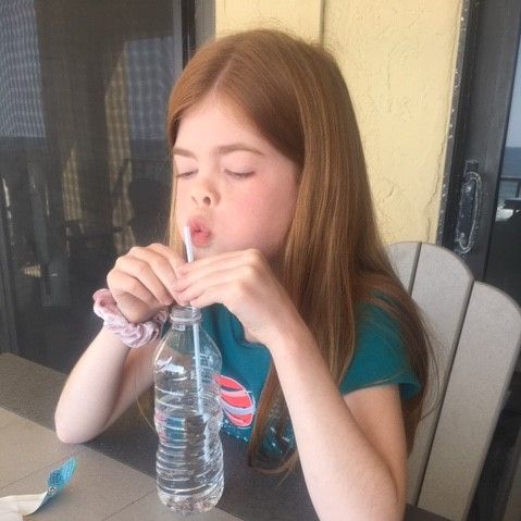 BriarwoodChrSch's tweet photo. Caroline Pruet (4th-Lowndes) uses a straw and water bottle to mimic a trombone as a science experiment. Moving the straw up or down in the water changes the pitch of the sound in much the same way moving the slide arm of a trombone does! #remotelearningplan #specialareaclasses https://t.co/7K9vMv7KCb