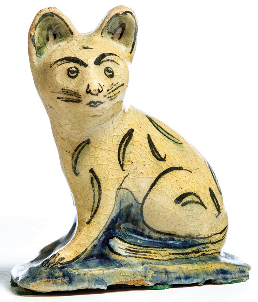 AntiqueDigest's tweet photo. Yellowware cat in a high glaze with black, blue, and green details, late 19th century, 7" high, sold for $510 (est. $150/250) at @Garthsauctions #antiques #antique #Americana #cat #cats #yellowware #glaze #ceramics #ceramic https://t.co/35fZxZHKca