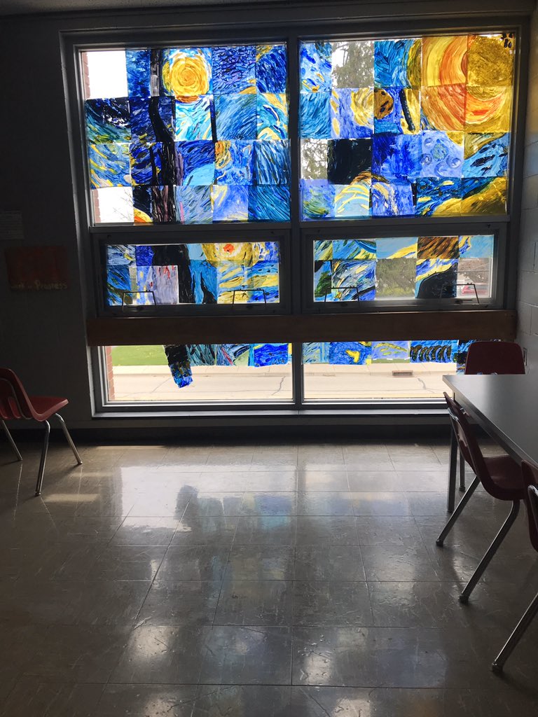 brittanyjdupont's tweet photo. In honor of our virtual art club meeting today, I give you the window painting that was *almost* completed. The picture does not do justice to the atmosphere this glowing light creates in the hall. #artclub #vangogh #windowmural #middleschoolart https://t.co/pmDpF26z5E