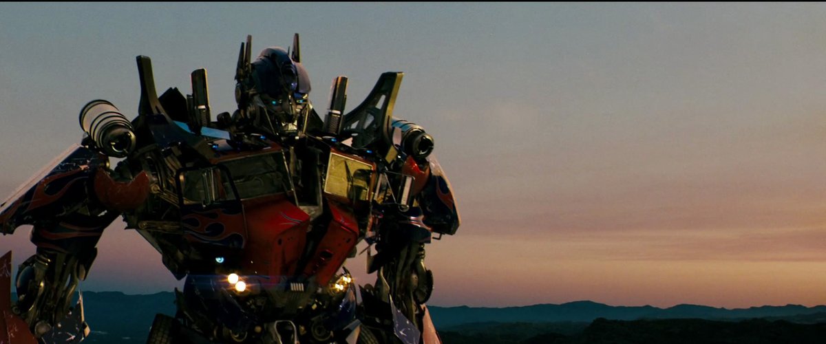 SilentDawnLB's tweet photo. the year is 2007. you've just watched the Autobots defeat the Decepticons. your popcorn/soda combo is on the floor empty next to your seat. Michael Bay's camera pans around Optimus Prime as he narrates. the sun is setting and "What I've Done" by Linkin Park is playing. https://t.co/5wU8XLo0Ou
