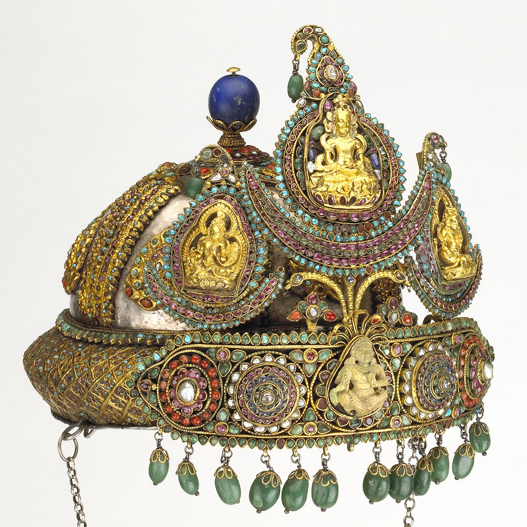 This ornate crown is decorated with emeralds, rubies and diamonds and other semi-precious stones It was probably made in the late 1800s in the Kathmandu Valley, Nepal  http://ow.ly/JLjq30qzNKF 