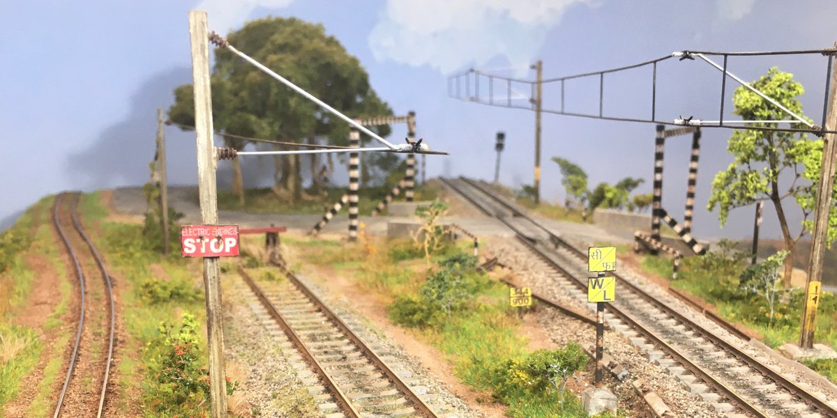 TDioramas's tweet photo. Panoramic view down the line. Who wants to take a stab at identifying those signs? https://t.co/886RdFJFOx
