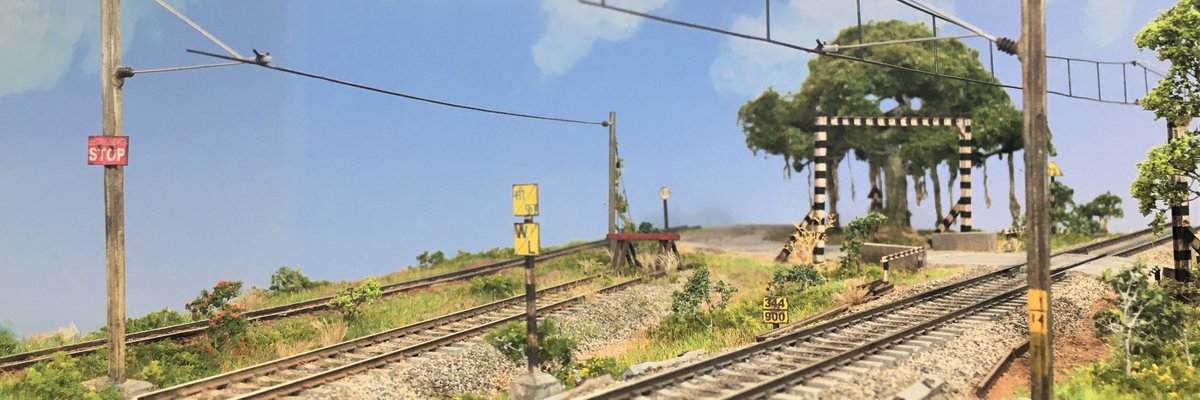 TDioramas's tweet photo. Panoramic view down the line. Who wants to take a stab at identifying those signs? https://t.co/886RdFJFOx
