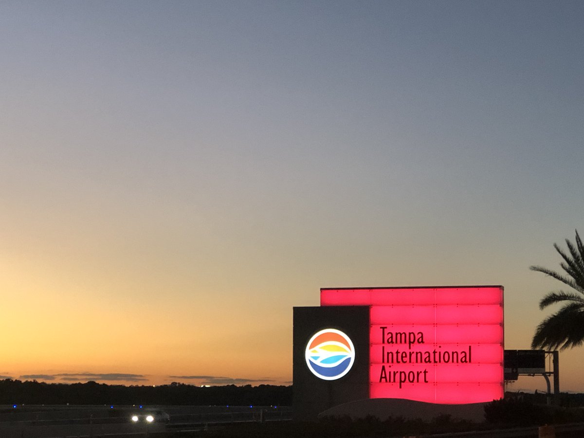 VisitTampaBay's tweet photo. Waking up to a few more red light displays in honor of #NTTW20. Look at that sky! We ♥️ you @FlyTPA. #SpiritofTravel https://t.co/vWvGDQwy3O