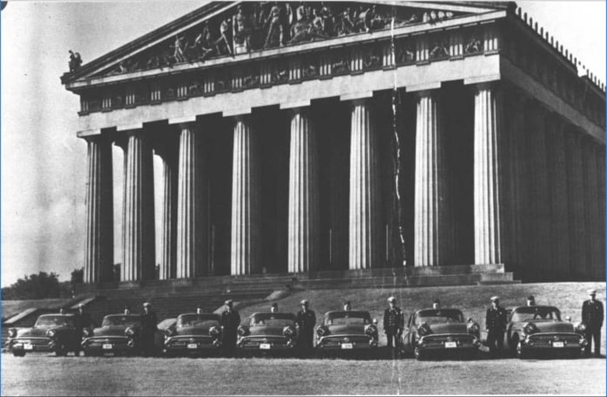 FireNashville's tweet photo. We Got New Chief Cars!
1957 picture of Nashville Fire Chiefs Leo McBride, Charlie Walker, Jessie Vaughn, Eligh Staley, Russell Campbell, William Gallagher and John D. Ragsdale, in front of the Parthenon in Centennial Park. #NFDStrong #NFDProud #NFDHistory https://t.co/dDo3Mkr4Q5