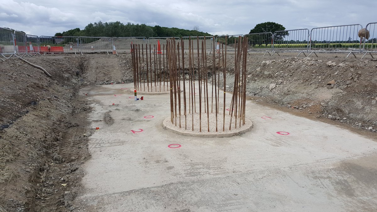 June 2017 - looking west - A428 on the right - here we see the tops of the piles (long concrete cyclinders going into the ground) - with steel reinforcing bar (rebar) sticking out - this is to provide a connection to the next part of the bridge 7/