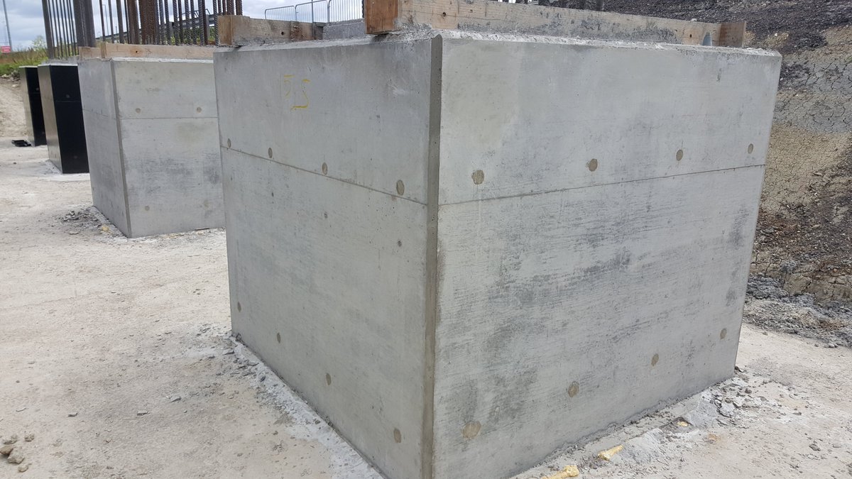 After curing (hardening of concrete) the shutters are struck, any minor defects are repaired - the small grey holes are where tie rods were used to bolts the shutters together to withstand the weight of the concrete, these are filled with mortar afterwards 11/