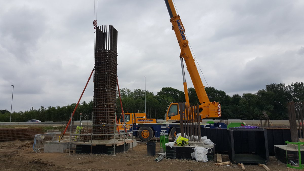 The column reinforcement is lifted into place and held by temporary props. The shutters (forms) for the concrete were made of metal so they could be reused for each column and specially fabricated in Germany 14/