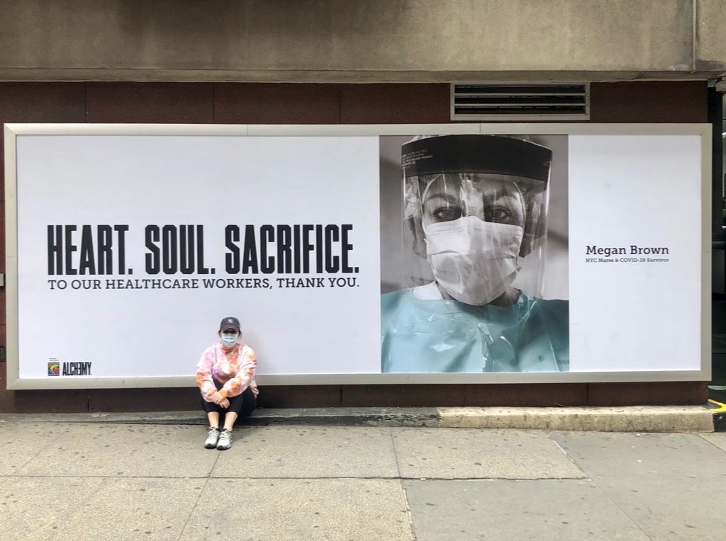 LoyolaMDAlumni's tweet photo. As a nurse in NYC, Megan Brown, '11, treats #COVID19 patients and is also a #COVID19 survivor. She was featured in an ad campaign in Times Square showing gratitude to healthcare workers. Her friend Brian De Sena, ’11, created the campaign>>https://t.co/tG0j1Y7Ni1 #ThankYouNurses https://t.co/dAzby3fQWb