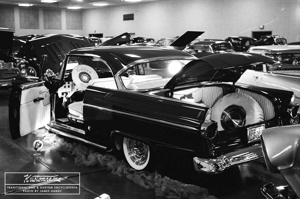 A mild 55 Ford custom belonging to a member of the Golden Gears car club. White rolled and pleated Naugahyde has been used to dress up the interior, the engine compartment, and trunk! If anyone recognizes the car, we would love to know who it belonged to: bit.ly/2ZmJOeV